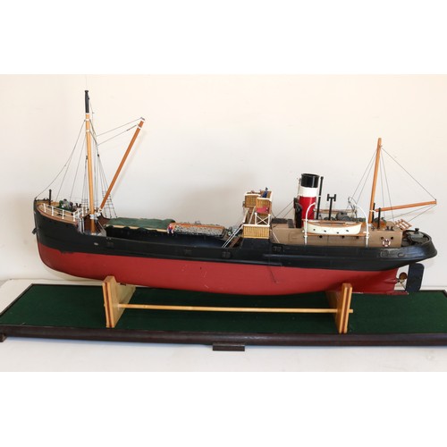 593 - Large radio controlled freighter model ship 'Talacre', fibreglass hull, wooden carry cradle, in glas... 