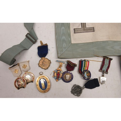 443 - Collection of silver and yellow metal medals of Masonic interest, including a gratitude medal, a col... 