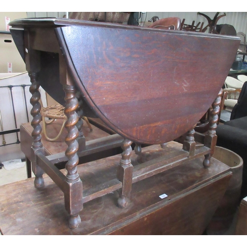 797 - 20th century oval oak gateleg table, D shaped leaves on barley twist supports with stretchers, L104c... 