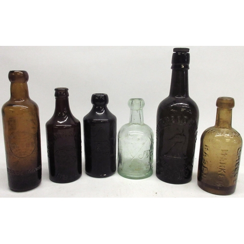 914 - Jewsbury and Brown clear glass soda water bottle and a brown glass ginger beer bottle, both with emb... 