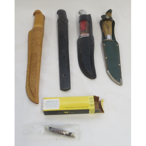 385 - Selection of five knives, including a deer foot handled sheath knife, a mini Buck folding knife in o... 