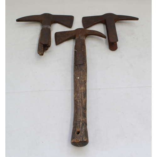 407 - Three metal axe heads, including a small fireman axe