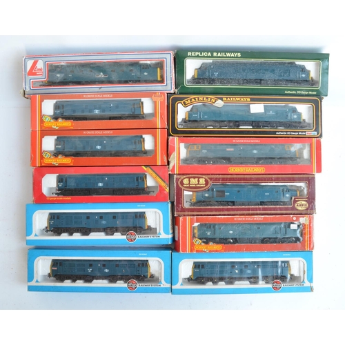 25 - Twelve previously run boxed OO gauge electric diesel locomotive train models (3x Class 31, 3x Class ... 