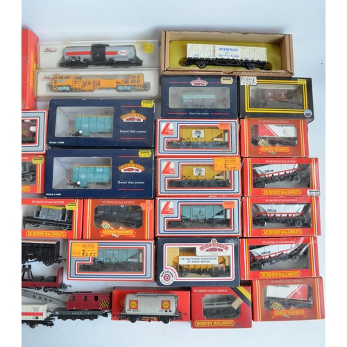 38 - Extensive collection of previously run mostly OO gauge railway goods wagons and rolling stock to inc... 