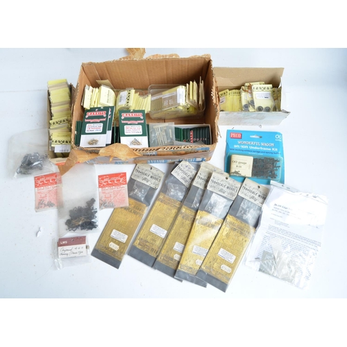 57 - Extensive collection of spare OO gauge railway model kit parts and spares to include wheels, PE deta... 