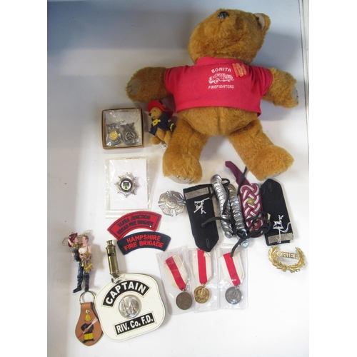 287 - Collection of firefighter themed memorabilia and ephemera, including patches, badges, three Polish m... 