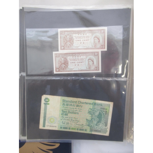 221 - Two folders containing American and other banknotes, to inc. 24 replica Confederate states banknotes... 