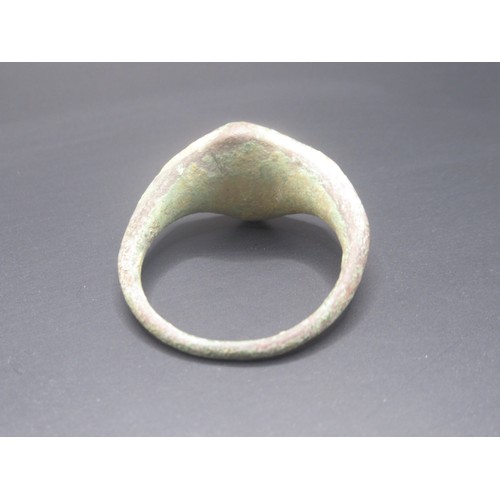 205 - A complete copper-alloy signet type finger ring of Post-Medieval date, c. AD 1400 - 1600. The upper ... 