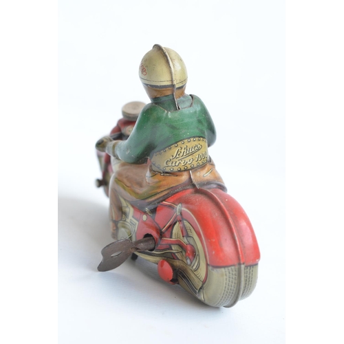 76 - Vintage Schuco Curvo 1000 clockwork litho printed tinplate motorbike model in working order, late 19... 