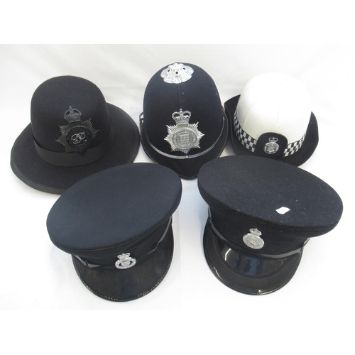 270 - Assortment of police-issue headwear. To include two black police caps, one marked 'North Yorkshire C... 