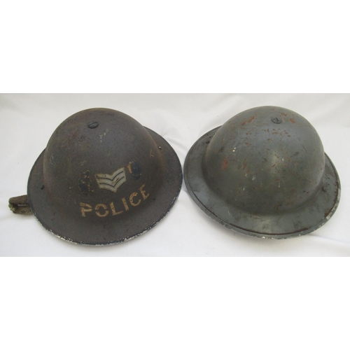 272 - Two c1940s British steel helmets, one for a police sergeant and one unmarked. Both complete with ori... 