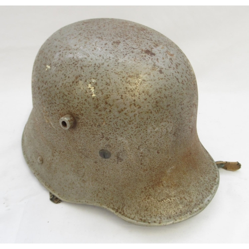 273 - M1916 'Stahlhelm' German steel helmet, containing later variant of lining, with age related wear