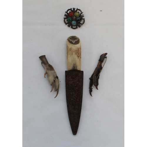 403 - Antler handled Sgian Dubh by Forsyth of Scotland. Grouse foot brooch and another. Five hard stone br... 