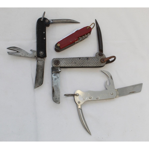 410 - Three military Jack Knives of different types. Harrisons of Sheffield, etc. and a Swiss army type ut... 