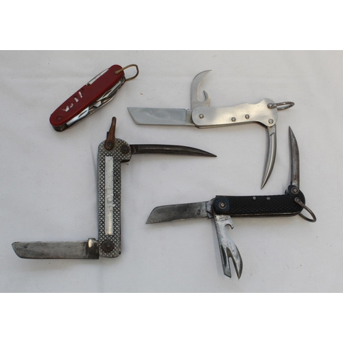 410 - Three military Jack Knives of different types. Harrisons of Sheffield, etc. and a Swiss army type ut... 