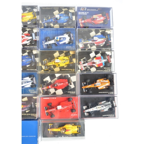 101 - Twenty six boxed/cased 1/43 scale diecast F1 and racing car models from Minichamps, Burago and Onyx,... 