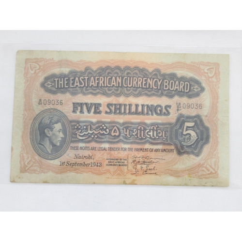 224 - Folder containing British and other banknotes to inc. MGM Studios reproduction £5 note, East African... 