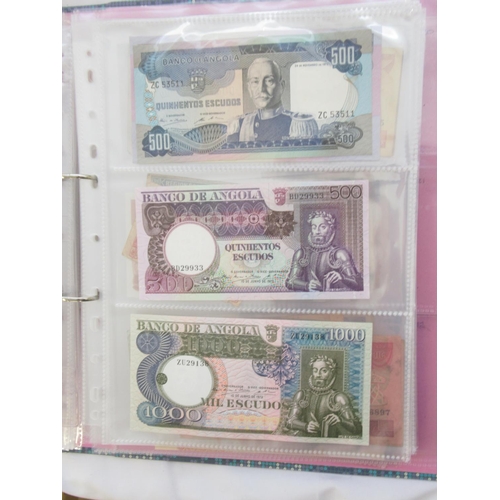 226 - Two folders containing assorted collection of International banknotes from Venezula, Angola, Ghana, ... 