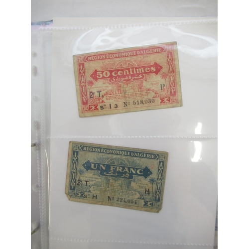 226 - Two folders containing assorted collection of International banknotes from Venezula, Angola, Ghana, ... 