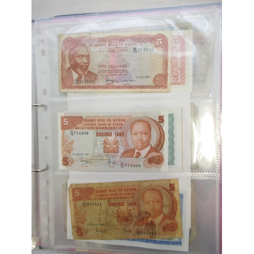 226 - Two folders containing assorted collection of International banknotes from Venezula, Angola, Ghana, ... 