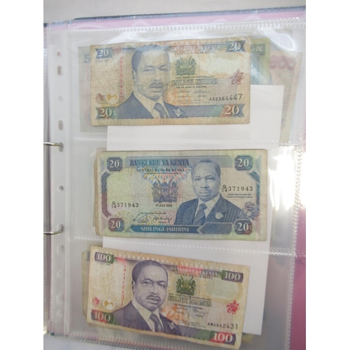 226 - Two folders containing assorted collection of International banknotes from Venezula, Angola, Ghana, ... 