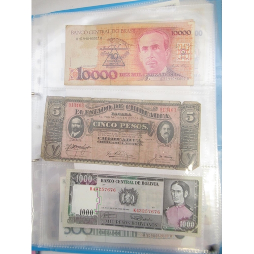 226 - Two folders containing assorted collection of International banknotes from Venezula, Angola, Ghana, ... 