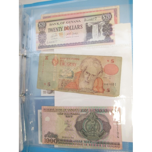 226 - Two folders containing assorted collection of International banknotes from Venezula, Angola, Ghana, ... 