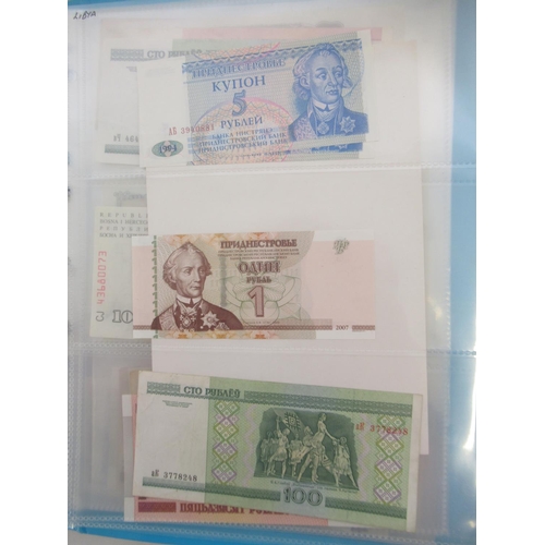 227 - Two folders containing mixed collection of International banknotes to inc. Mongolia, Moldova, Bosnia... 