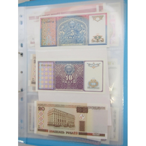 227 - Two folders containing mixed collection of International banknotes to inc. Mongolia, Moldova, Bosnia... 