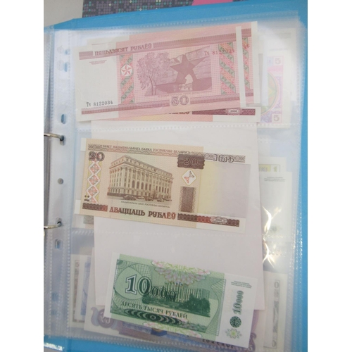 227 - Two folders containing mixed collection of International banknotes to inc. Mongolia, Moldova, Bosnia... 