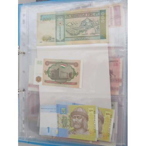 227 - Two folders containing mixed collection of International banknotes to inc. Mongolia, Moldova, Bosnia... 