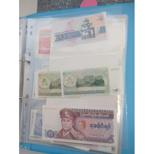 227 - Two folders containing mixed collection of International banknotes to inc. Mongolia, Moldova, Bosnia... 