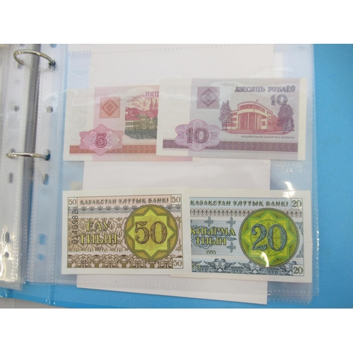 227 - Two folders containing mixed collection of International banknotes to inc. Mongolia, Moldova, Bosnia... 