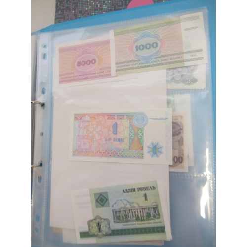 227 - Two folders containing mixed collection of International banknotes to inc. Mongolia, Moldova, Bosnia... 