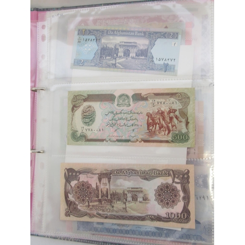 227 - Two folders containing mixed collection of International banknotes to inc. Mongolia, Moldova, Bosnia... 