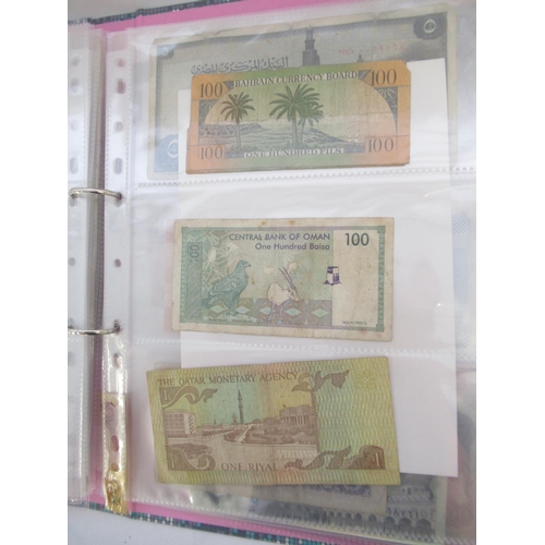 227 - Two folders containing mixed collection of International banknotes to inc. Mongolia, Moldova, Bosnia... 