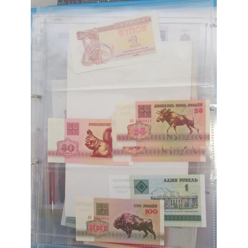 227 - Two folders containing mixed collection of International banknotes to inc. Mongolia, Moldova, Bosnia... 