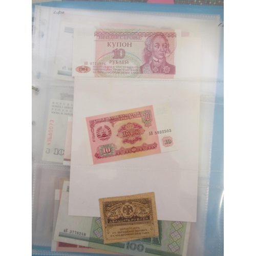 227 - Two folders containing mixed collection of International banknotes to inc. Mongolia, Moldova, Bosnia... 