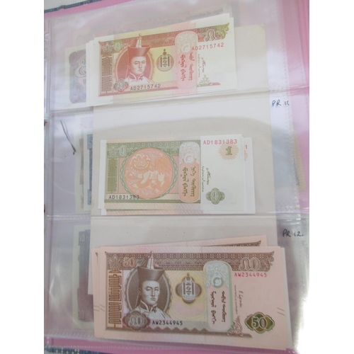 228 - Two folders containing mixed International banknotes from North Korea, Singapore, Indonesia, Malaysi... 