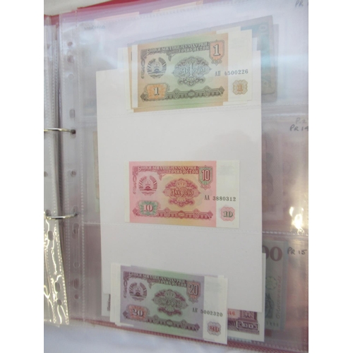 223 - Two folders containing International banknotes from India, Japan, Republic of China, Myanmar, Cambod... 