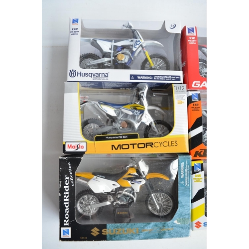 104 - Nine boxed 1/12th scale motocross and road bike models from New Ray and Maisto (models in at least e... 