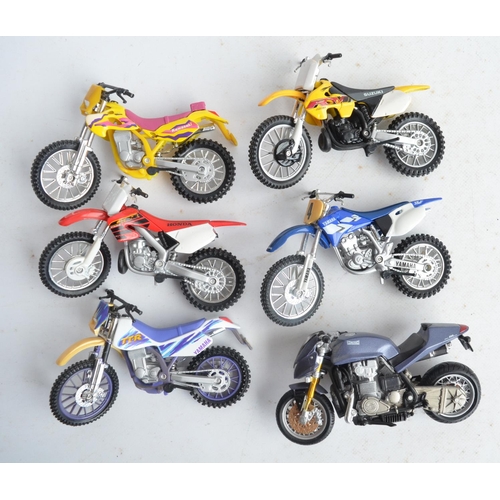 104 - Nine boxed 1/12th scale motocross and road bike models from New Ray and Maisto (models in at least e... 