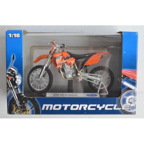 104 - Nine boxed 1/12th scale motocross and road bike models from New Ray and Maisto (models in at least e... 