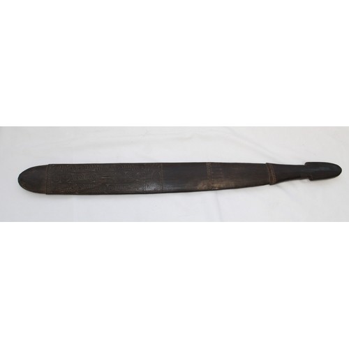 417 - Trobriand Island Sword club of the Massim People. Made from a hard wood carved with traditional scro... 