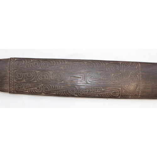 417 - Trobriand Island Sword club of the Massim People. Made from a hard wood carved with traditional scro... 