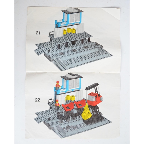 128 - Three vintage unboxed Lego sets with original instructions to include 7838 loading station (1983), 1... 