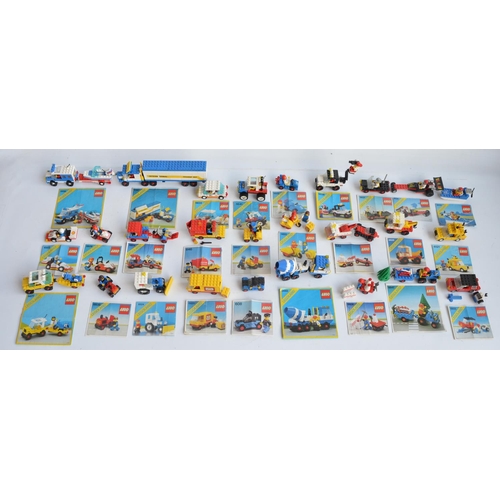 129 - Twenty seven small vintage unboxed Lego/Legoland Lego town sets, all complete and all with original ... 