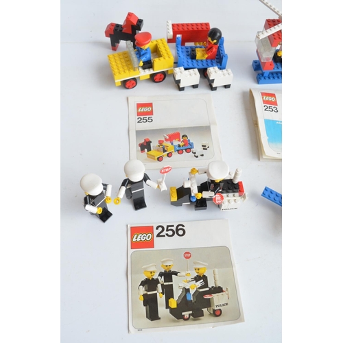 132 - Six vintage unboxed Lego sets with original instructions, please note set 213 missing pilots cap, ot... 