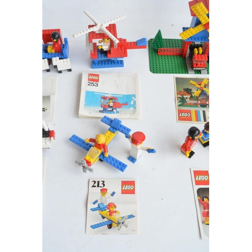 132 - Six vintage unboxed Lego sets with original instructions, please note set 213 missing pilots cap, ot... 