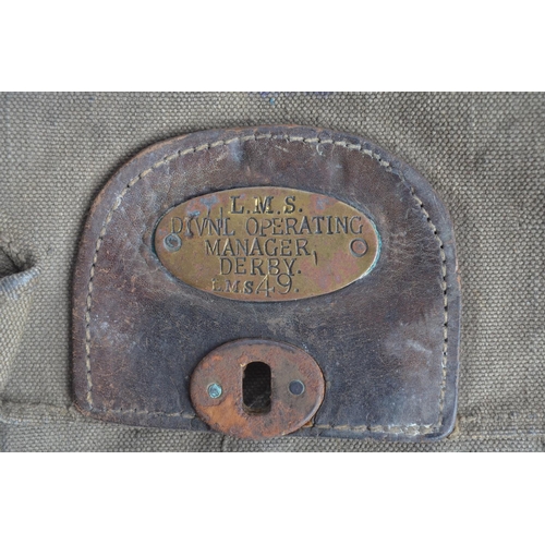 142 - Vintage LMS (Derby) cash bag, a collection of brass pay cheques, railway buttons and an enamelled me... 